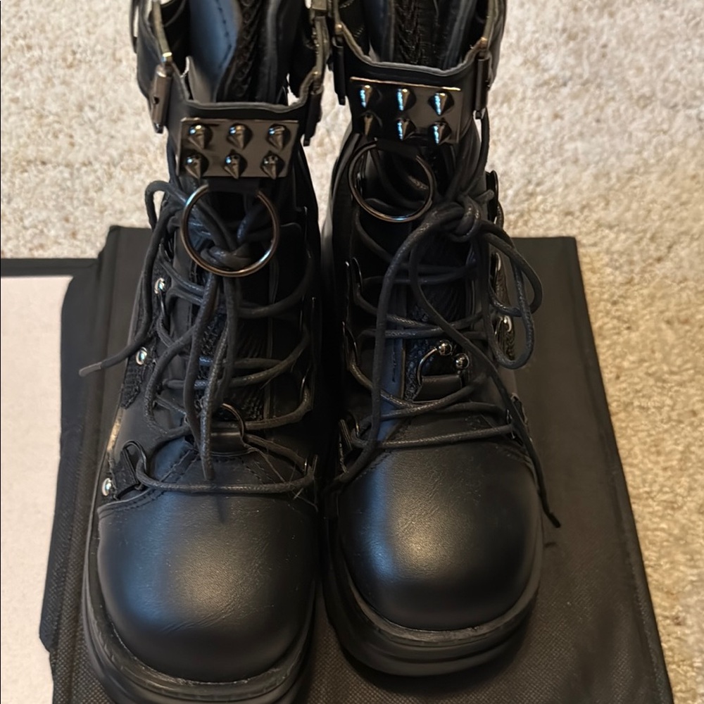 Edgy Black Combat Boots with‎ Metallic Accents